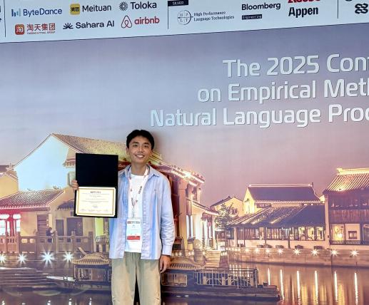 Siyu Liang holding an award at the EMNLP 2025 conference.