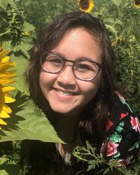 portrait of juliette in a sunflower field