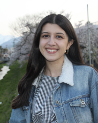 image of a woman smiling with long dark hair
