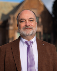 Richard Wright portrait standing in front of Guggenheim hall