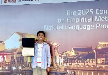 Siyu Liang holding an award at the EMNLP 2025 conference.