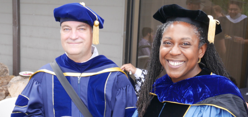Professors Richard Wright and Alicia Wassink in regalia at graduation