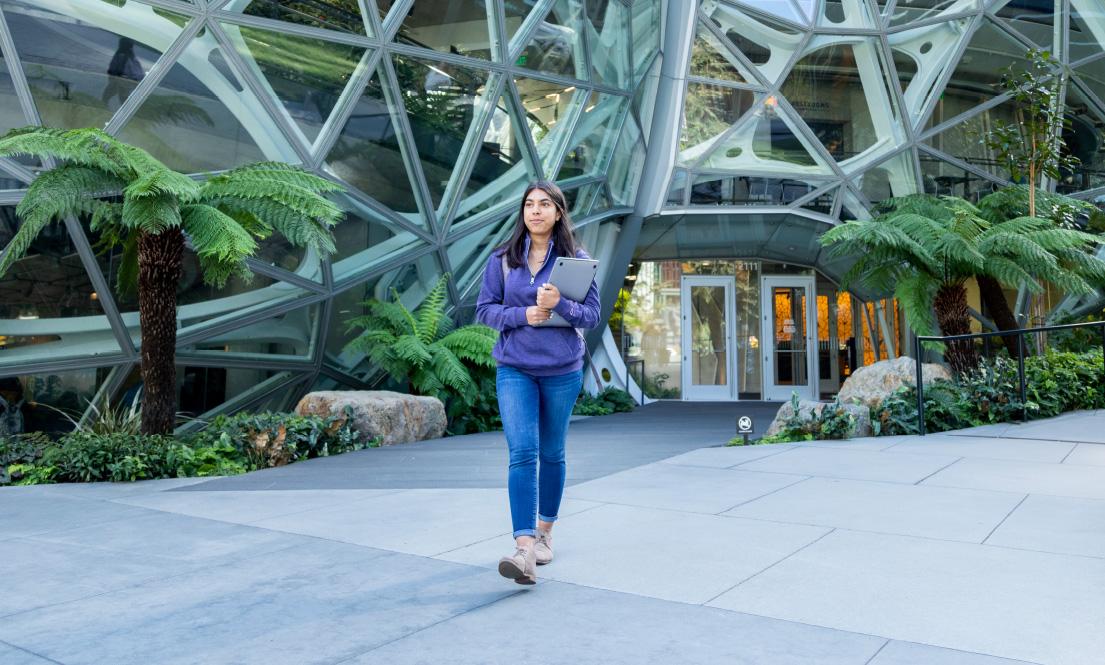 student walking in front of amazon building spheres in Seattle