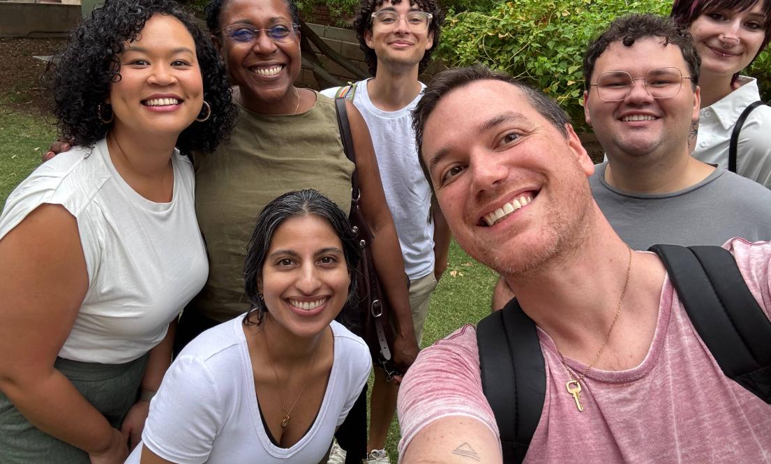 A group of people smiling at the camera