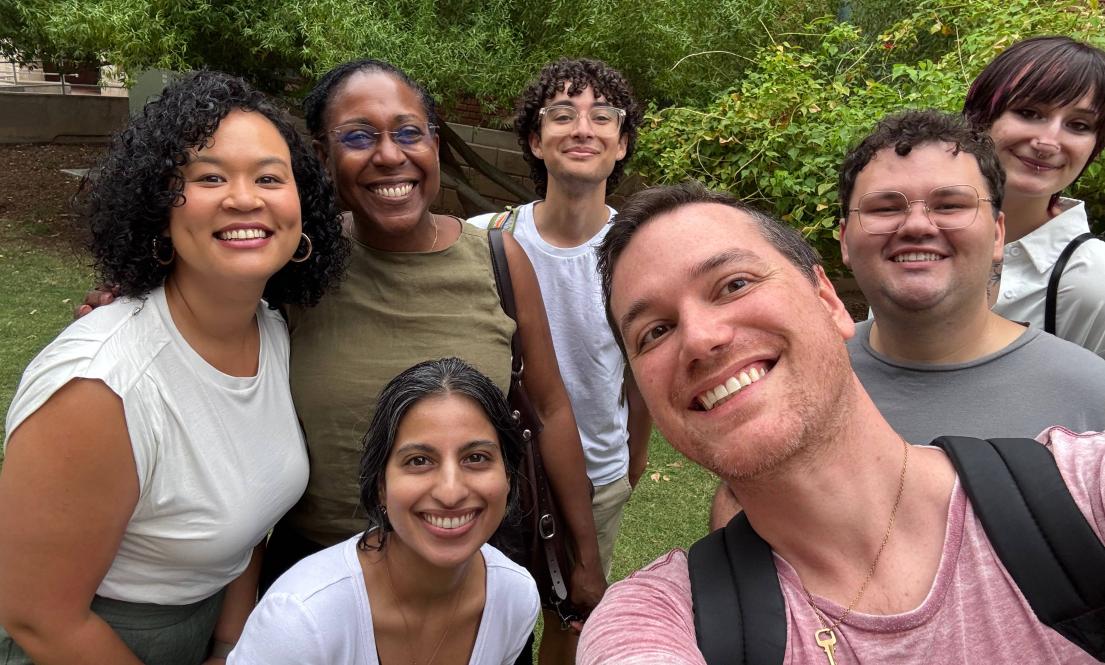A group of people smiling at the camera